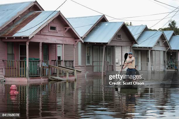 Marine veterans Rocky Damico with the Wounded Veterans of Oklahoma searches for residents in need of help after torrential rains pounded Southeast...