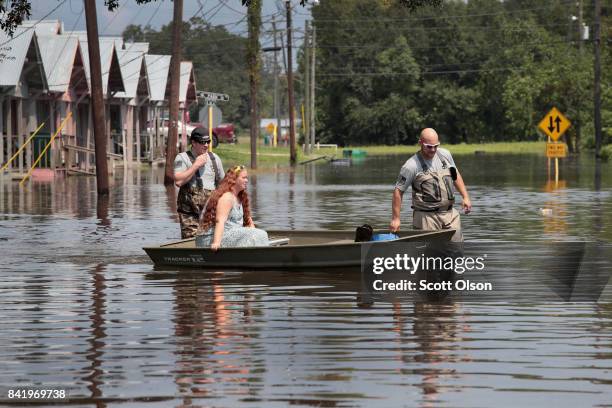 Members of the Wounded Veterans of Oklahoma help to rescue flood victims after torrential rains pounded Southeast Texas following Hurricane and...