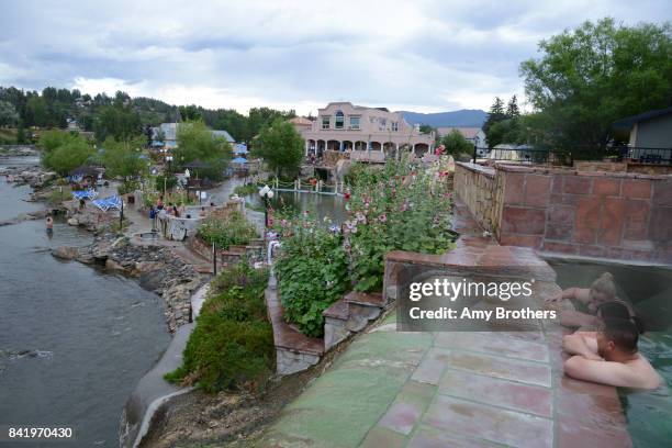 From right Brian, Leana and Kali Nelson soak in the natural hot springs, in Pagosa Springs, Colorado, on July 30, 2017.