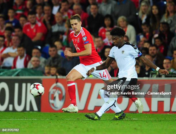 Austrias David Alaba under pressure from Wales David Edwards during the FIFA 2018 World Cup Qualifier between Wales and Austria at Cardiff City...