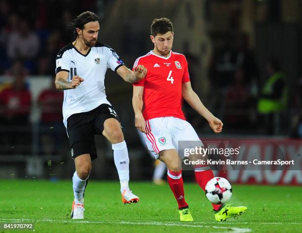 Wales Ben Davies under pressure from Austrias Martin Harnik during the FIFA 2018 World Cup Qualifier between Wales and Austria at Cardiff City...