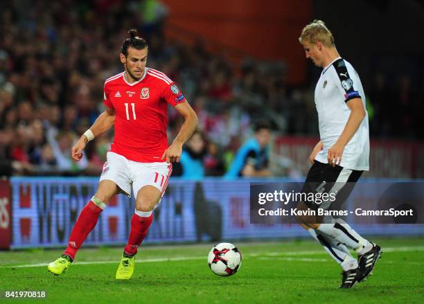 Wales Gareth Bale under pressure from Austrias Martin Hinteregger during the FIFA 2018 World Cup Qualifier between Wales and Austria at Cardiff City...