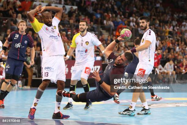 Luka Karabatic of Paris Saint Germain is shooting the ball against Rock Feliho of HBC Nantes during the Final of the Trophee des Champions between...
