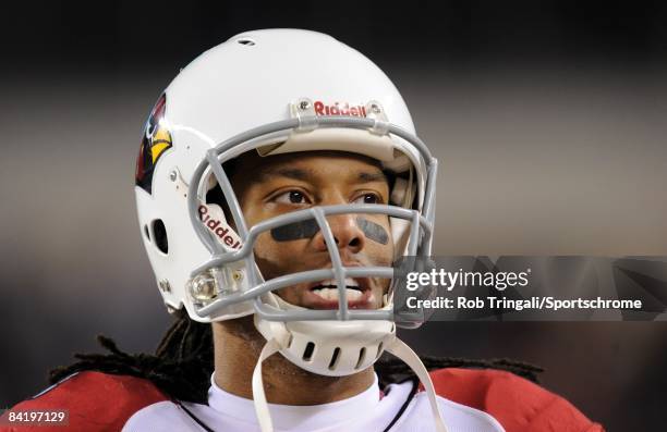 Wide receiver Larry Fitzgerald Cardinals looks on against the Philadelphia Eagle defends s at Lincoln Financial Field on November 27, 2008 in...