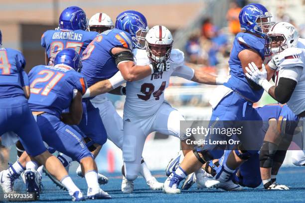 Defensive end Seth Calloway of the Troy Trojans plugs a defensive hole during first half action against the Boise State Broncos on September 2, 2017...