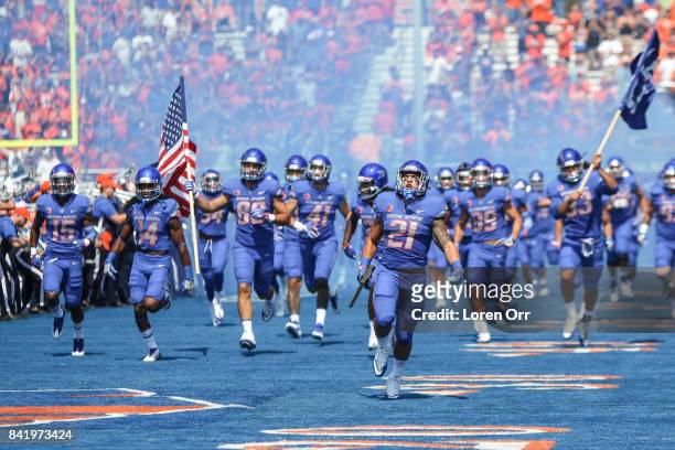 Running back Ryan Wolpin of the Boise State Broncos carries the hammer and leads the Broncos into the stadium prior to that start of first half...