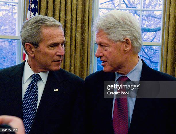 President George W. Bush talks with former President Bill Clinton during a photo-op with other former presidents and incoming President-elect Barack...