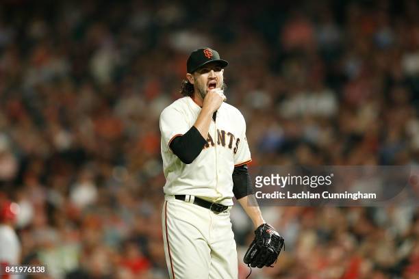 Cory Gearrin of the San Francisco Giants walks back to the dugout after pitching the sixth inning against the St Louis Cardinals at AT&T Park on...
