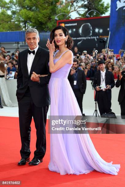 George Clooney and Amal Clooney walk the red carpet ahead of the 'Suburbicon' screening during the 74th Venice Film Festival at Sala Grande on...