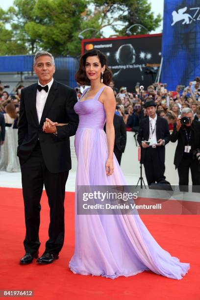 George Clooney and Amal Clooney walk the red carpet ahead of the 'Suburbicon' screening during the 74th Venice Film Festival at Sala Grande on...