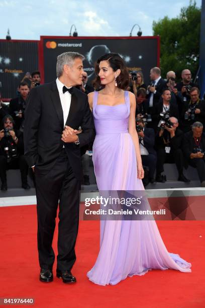 George Clooney and Amal Clooney walk the red carpet ahead of the 'Suburbicon' screening during the 74th Venice Film Festival at Sala Grande on...