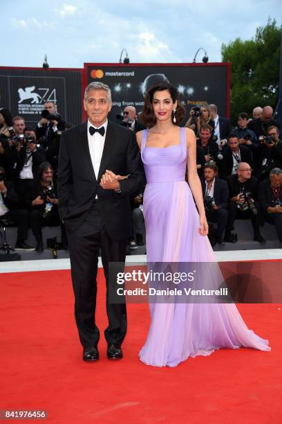 George Clooney and Amal Clooney walk the red carpet ahead of the 'Suburbicon' screening during the 74th Venice Film Festival at Sala Grande on...