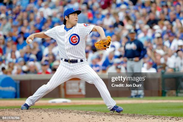 Koji Uehara of the Chicago Cubs pitches against the Atlanta Braves during the seventh inning at Wrigley Field on September 2, 2017 in Chicago,...