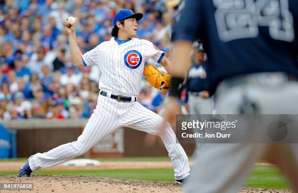 Koji Uehara of the Chicago Cubs pitches against the Atlanta Braves during the seventh inning at Wrigley Field on September 2, 2017 in Chicago,...