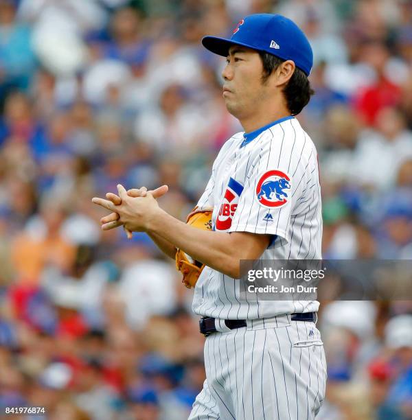 Koji Uehara of the Chicago Cubs between pitches during the seventh inning of the game against the Atlanta Braves at Wrigley Field on September 2,...