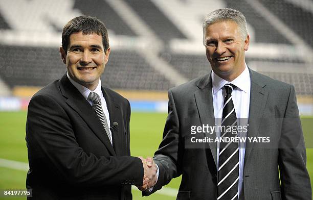 Nigel Clough, new manager of Derby County, poses for photographers with Club chairman Adam Pearson on the pitch before a League cup semi final first...
