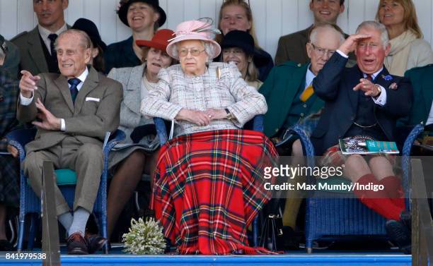 Prince Philip, Duke of Edinburgh, Queen Elizabeth II and Prince Charles, Prince of Wales attend the 2017 Braemar Gathering at The Princess Royal and...