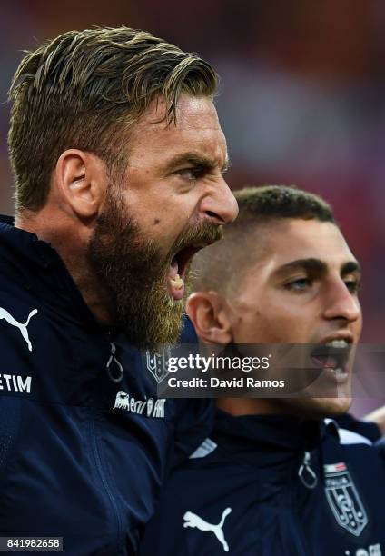 Daniele de Rossi and Marco Verratti of Italy sing the Italy's national anthem prior to the FIFA 2018 World Cup Qualifier between Spain and Italy at...