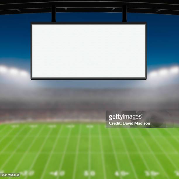 jumbotron large scale screen in sports stadium - écran géant photos et images de collection