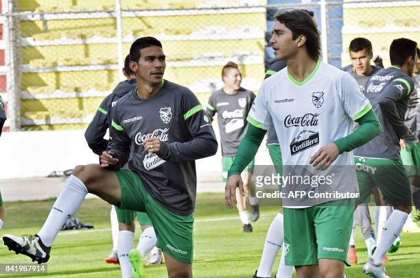 Bolivia players Diego Bejarano and Marcelo Martins take part in a training session of the Bolivian national football team on September 2 in the...