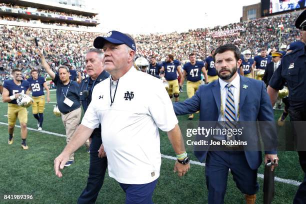 Head coach Brian Kelly of the Notre Dame Fighting Irish leaves the field after a game against the Temple Owls at Notre Dame Stadium on September 2,...