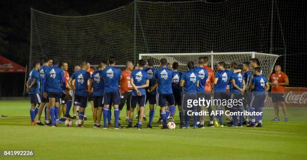 Paraguay's national football team coach Francisco Arce gives instructions to his players during a training session at the Complejo Albiroga training...