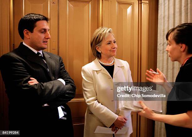 Secretary of State-designate and U.S. Senator Hillary Clinton refuses to take questions while waiting for an elevator with her press secretary...