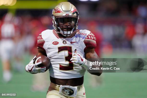 Cam Akers of the Florida State Seminoles warms up prior to their game against the Alabama Crimson Tide at Mercedes-Benz Stadium on September 2, 2017...