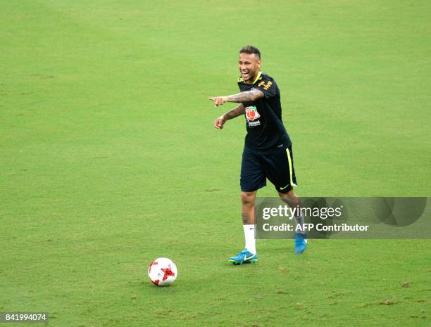 Brazil's striker Neymar gestures during a training session in Arena Amazonia, Manaus, Brazil, on September 2, 2017 ahead of their upcoming 2018 FIFA...