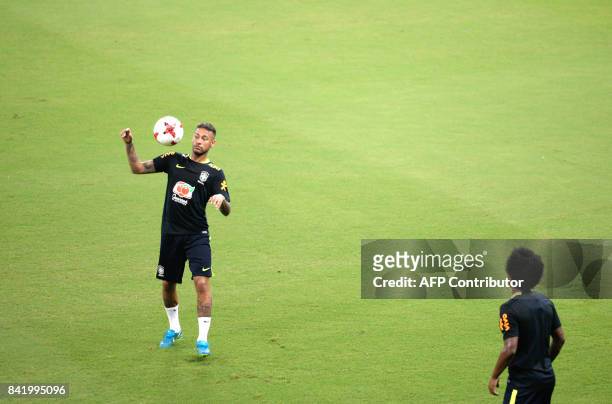 Brazil's striker Neymar takes part in a training session in Arena Amazonia, Manaus, Brazil, on September 2, 2017 ahead of their upcoming 2018 FIFA...