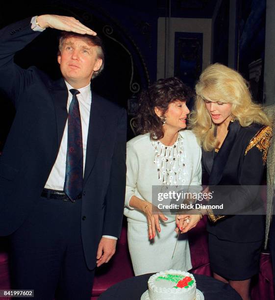 Donald J. Trump, unkown and Actress/Wife Marla Maples celebrate at The Hard Rock Cafe her role in a theatrical performance in Atlanta Georgia. Circa...
