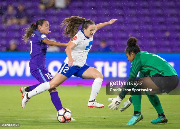 Boston Breakers defender Allysha Chapman defends Orlando Pride forward Marta Vieira de Silva as Boston Breakers goalkeeper Abby Smith makes the save...