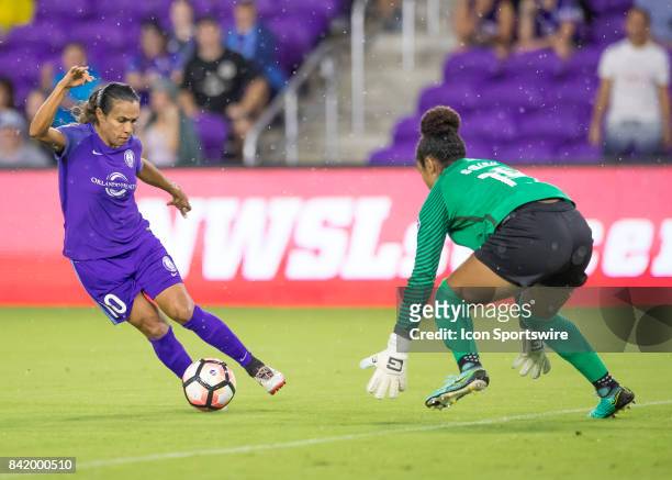 Orlando Pride forward Marta Vieira de Silva looks to shoot on goal at Boston Breakers goalkeeper Abby Smith during the NWSL soccer match between the...