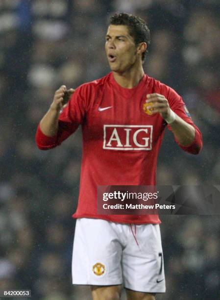 Cristiano Ronaldo of Manchester United reacts to his free-kick narrowly missing the target during the Carling Cup Semi-Final First Leg match between...