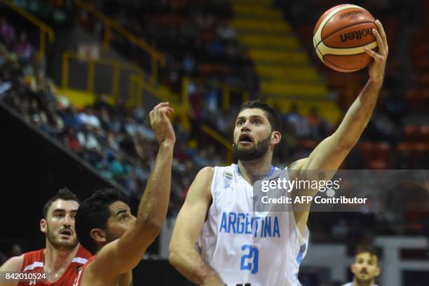 Argentina's small forward Patricio Garino shoots against Mexico during their 2017 FIBA Americas Championship semifinals match in Cordoba, Argentina,...