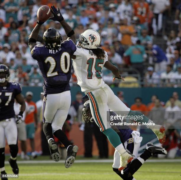 Ed Reed of the Baltimore Ravens breaks up a pass intended for Davone Bess of the Miami Dolphins during the AFC Wild Card Game at Dolphin Stadium on...