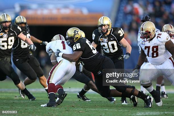 Greg Billinger of the Vanderbilt Commodores tackles Josh Haden of the Boston College Eagles during the Gaylord Hotels Music City Bowl at LP Field on...
