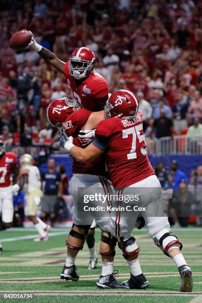 Calvin Ridley of the Alabama Crimson Tide celebrates after scoring on a two-point conversion against the Florida State Seminoles during their game at...