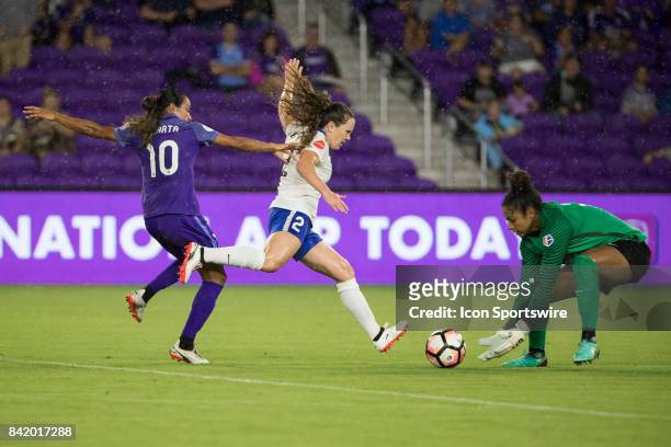 Orlando Pride forward Marta takes a shot on goal and it is blocked by Boston Breakers goalkeeper Abby Smith during the NWSL soccer match between the...