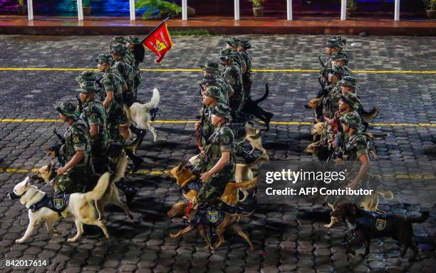 Nicaraguan K9 army soldiers march during military parade commemorating the 38th anniversary of the founding of the Nicaraguan army, at Square "Juan...