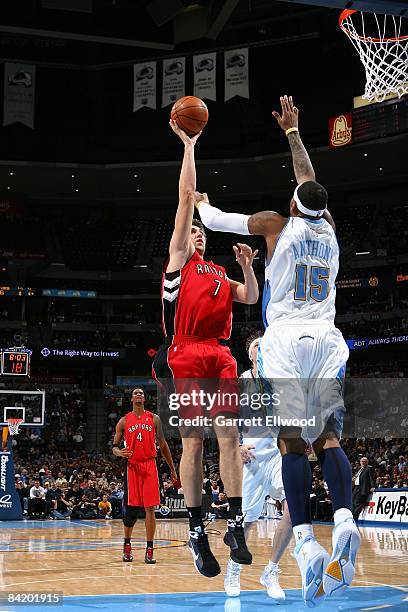 Andrea Bargnani of the Toronto Raptors lays up a shot against Carmelo Anthony of the Denver Nuggets during the game on December 2, 2008 at the Pepsi...