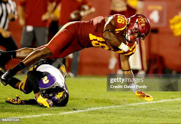 Wide receiver Marchie Murdock of the Iowa State Cyclones falls into the end zone for a touchdown as defensive back Malcolm Washington of the Northern...