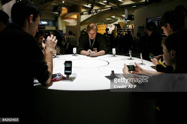 Apple consumers explore the features of various iPhone and iPod models during the Macworld Expo 2009 in San Francisco, CA, Wednesday, January 7,...