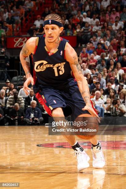 Delonte West of the Cleveland Cavaliers moves the ball up court during the game against the Miami Heat at American Airlines Arena on December 30,...