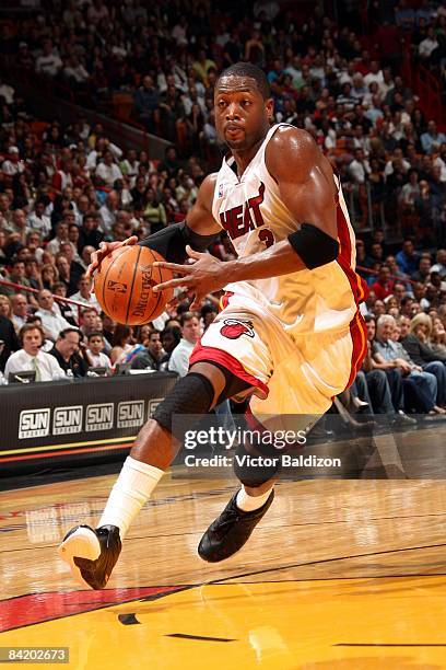 Dwyane Wade of the Miami Heat drives to the basket during the game against the Cleveland Cavaliers at American Airlines Arena on December 30, 2008 in...