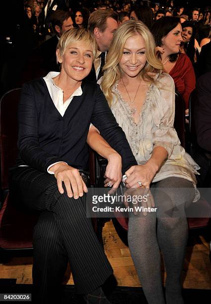 Personality Ellen DeGeneres and actress Portia de Rossi pose in the audience during the 35th Annual People's Choice Awards held at the Shrine...