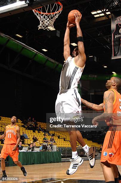 Jarvis Gunter of the Erie BayHawks dunks over Cory Underwood of the Albuquerque Thunderbirds during the NBA D-League Showcase at McKay Events Center...