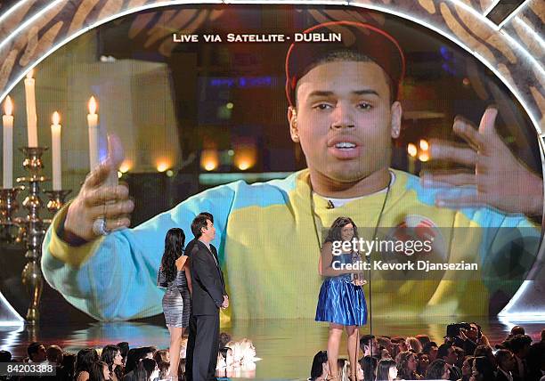Singer Jordin Sparks and Chris Brown accepts the Combined Forces award during the 35th Annual People's Choice Awards held at the Shrine Auditorium on...