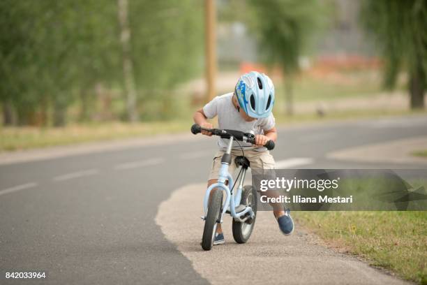 four years old boy and his bicycle - 4 5 years stock pictures, royalty-free photos & images