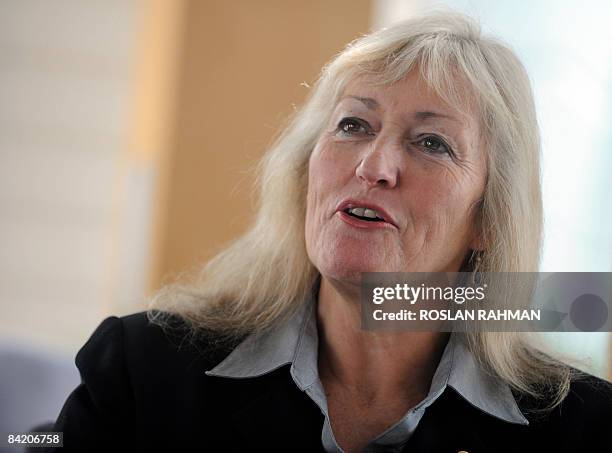 Australian June Kane, a child labour expert speaks to a reporter during an interview at the United Nations Children's Fund Conference for East Asia...